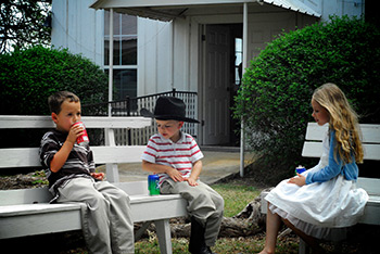 Some young singers socialize during recess. Some young singers socialize during recess.
