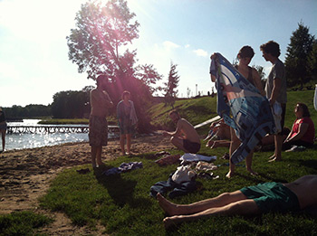 Singers take a quick (and chilly) dip in the lake at Wichrowe Wzgórze before orientation. Photograph by Lauren Bock. Singers take a quick (and chilly) dip in the lake at Wichrowe Wzgórze before orientation. Photograph by Lauren Bock.